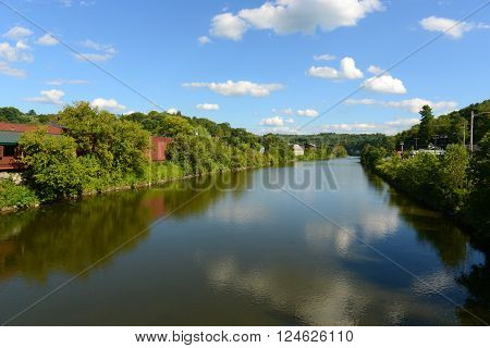 Winooski River cross the center of Montpelier in summer, Montpelier, Vermont, USA. Montpelier is the capital of Vermont and is the smallest capital city in the United States.