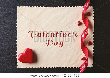 Blank present Valentine card on black textured background