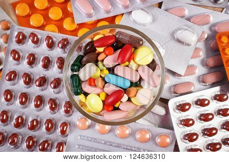 Colorful medical pills and capsules for therapy and blisters of tablets or supplements, concept of treatment and health care
