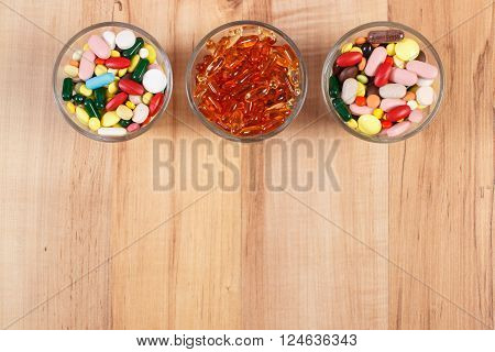Heap of colorful medical pills, capsules or supplements for therapy, concept of treatment and health care, copy space for text or inscription