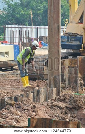 MALACCA, MALAYSIA -SEPTEMBER 25, 2015: Temporary steel sheet retaining wall using sheet pile cofferdam method holding outside soil from collapse into pile pits.