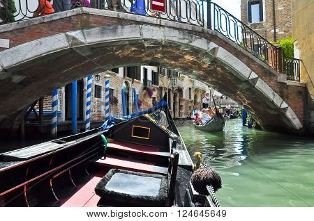 VENICE-JUNE 15: Gondola on the Venetian canal on June 15 2012 in Venice Italy.