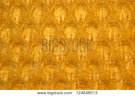 Amber Bubble Wrap Packing Or Air Cushion Film Abstract Background
