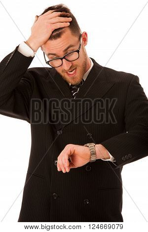 Successful businessman in formal suit chacking time on wrist watch isolated over white.