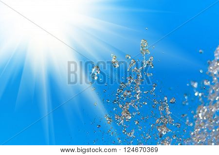 Water fountain on a background of blue sky