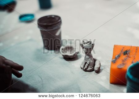 children's hands sculpts clay crafts pottery school