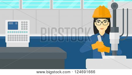 Woman working with industrial equipment.