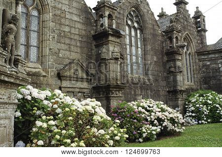Guimiliau (Finistere Brittany France): the medieval church with the typical stone calvary