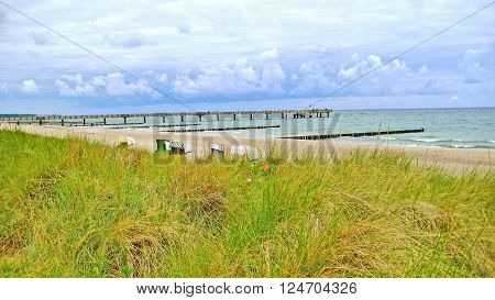 Behind the beach of Kuehlungsborn Baltic Sea Germany with view towards the pier