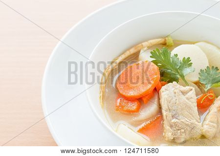 Pork soup and vegetable in a white bowl