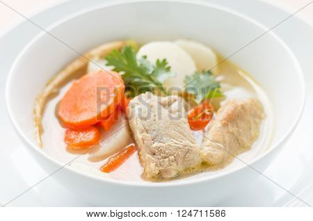 Pork soup and vegetable in a white bowl