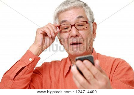 portrait of senior Japanese man with presbyopia