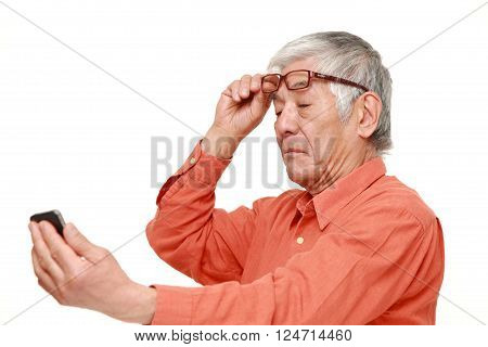 portrait of senior Japanese man with presbyopia
