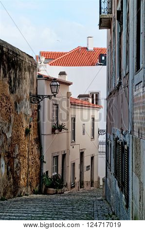 Old narrow street in the city of Lisbon. Portugal