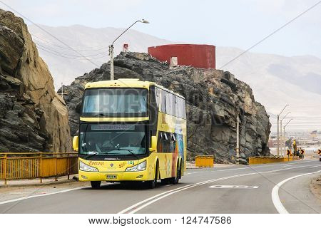 CHANARAL, CHILE - NOVEMBER 18, 2015: Yellow intercity coach Modasa Zeus at the interurban freeway.