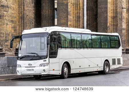 SAINT PETERSBURG RUSSIA - MAY 25 2013: Touristic coach JAC HK6120 in the city street.