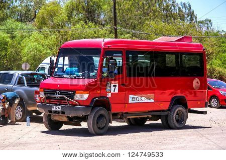 SAN PEDRO DE ATACAMA CHILE - NOVEMBER 17 2015: Off-road touristic bus Mercedes-Benz Vario 818D in the town street.