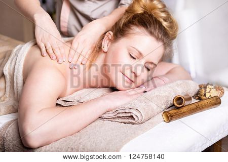 Caucasian pretty woman having body massage
Beauty treatment concept.
