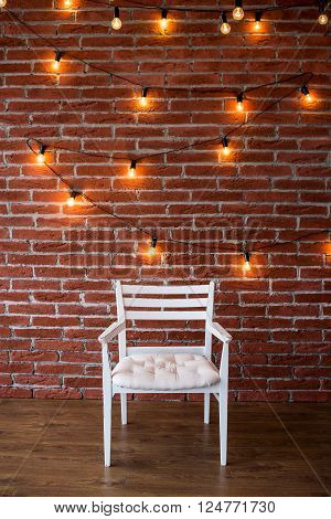 white chair against a background of a brick wall with a garland
** Note: Visible grain at 100%, best at smaller sizes