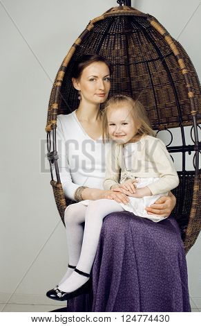 young mother with daughter at luxury home interior vintage, old fashion relashionship family