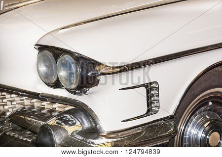 HALTERN NRW GERMANY - FEBRUARY 1 2016:
Detail US Car of the 50s headlight of a classic car at an exhibition.
