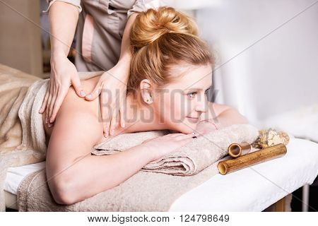 Caucasian pretty woman having body massage
Beauty treatment concept.