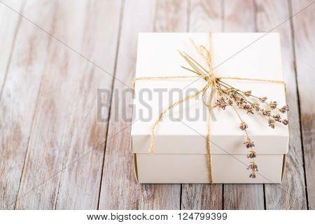 White Present box with rustic twine and sprig of lavender