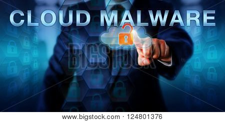 Enterprise executive is pointing at CLOUD MALWARE on a virtual touch screen interface. Information technology and computer security concept for malicious software attacks targeting the cloud.