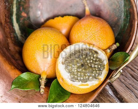 Granadilla fruits in the bruzen bucket.