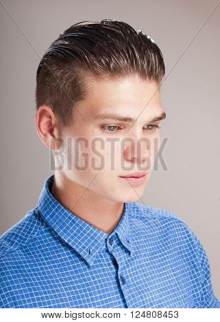 Profile of gallant man in the blue shirt.