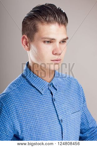 Profile of gallant man in the blue shirt.