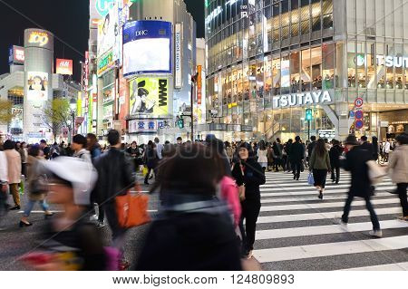 Tokyo, Japan - March 29, 2016: Shibuya Crossing at Night, Crowds of people at Shibuya Crossing on 29 March 2016 in Tokyo, Japan. Shibuya Crossing is one of the busiest crosswalks in the world.