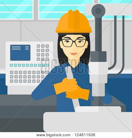 Woman working with industrial equipment.