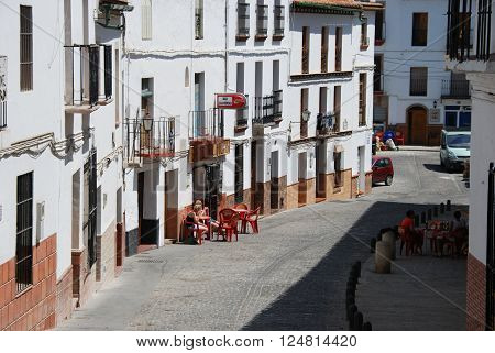 ALORA, SPAIN - JUNE 27, 2008 - People relaxing at bars along a town street Alora Malaga Province Andalusia Spain Western Europe, June 27, 2008.