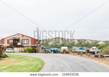 PORT ELIZABETH SOUTH AFRICA - FEBRUARY 26 2016: Rain is visible in a street scene at Cannonville in Colchester in the Eastern Cape Province of South Africa