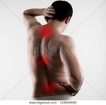 Reflexology. Spinal pain cure. Body of young Caucasian male with red points on painful zones.