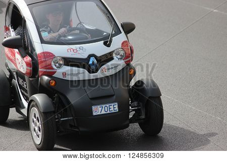 Monte-Carlo Monaco - April 6 2016: Electric Car Renault Twizy on Avenue d'Ostende in Monaco. Woman Driving an Electric Car Sharing Vehicles (Mobee) in the south of France