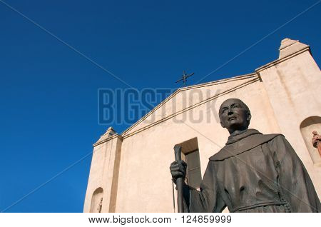 April 3 2016: Photo of Mission San Gabriel Arcangel with statue of Junipero Serrawhich is located in San Gabriel Californa USA.