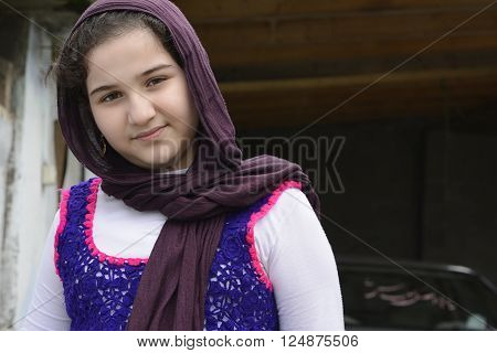 Portrait of Teenage Beautiful Girl Wearing Traditional Knitted Cloth with Shawl