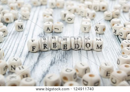 Wood Blocks with the word Feedom. Wooden ABC.