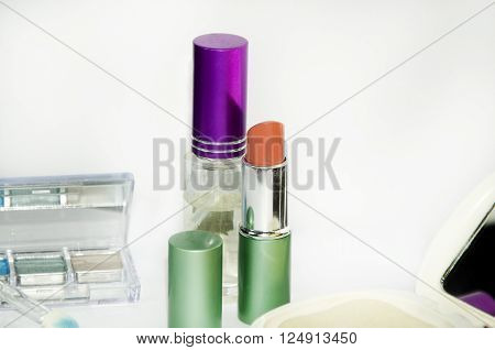 women make up simple equipment such as lipstick and powder shadow