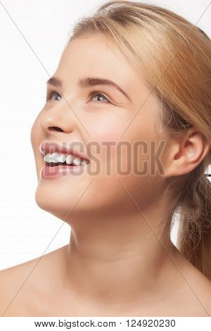 Girl With Very Large Smile Looking Up On White Background