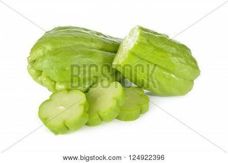 whole and sliced fresh chayote on white background