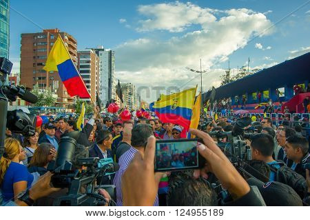 Quito, Ecuador - April 7, 2016: Closeup opposition leader Andres Paez surrounded by people, police and journalists during anti government protests in Shyris Avenue.