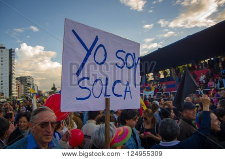 Quito, Ecuador - April 7, 2016: Group of people Holding protest signs, police and journalists during anti government protests in Shyris Avenue.