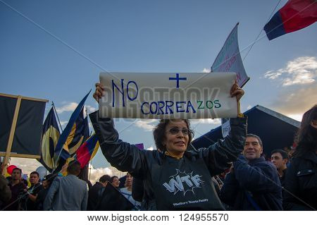 Quito, Ecuador - April 7, 2016: Group of people Holding protest signs, police and journalists during anti government protests in Shyris Avenue.