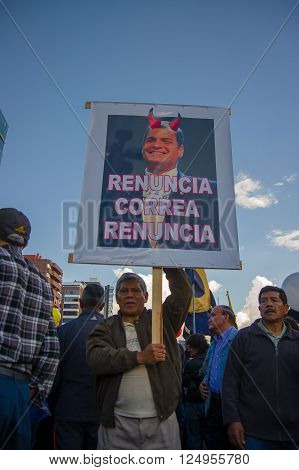 Quito, Ecuador - April 7, 2016: Group of people Holding protest signs, police and journalists during anti government protests in Shyris Avenue.