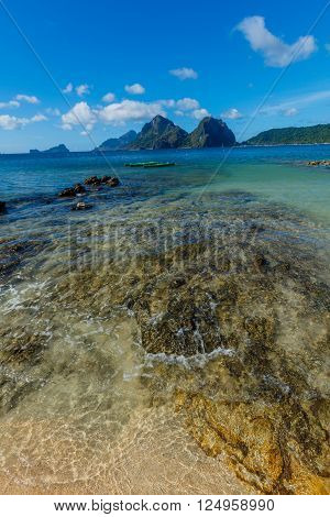 Beautiful landscape with palms, beach and sea El-nido, Palawan, Philippines