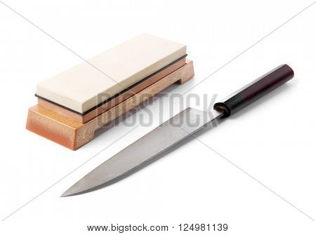 Traditional japanese kitchen knife and grinding water stone. Isolated on white.