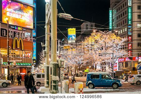 SAPPORO, JAPAN - December 25, 2015: Street view of Buildings around city night, one of the most popular tourist destinations in Sapporo, Hokkaido, Japan. 